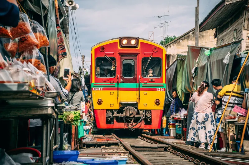 Ancient Ayutthaya temple ruins at golden hour followed by floating market vendors on a Bangkok Thailand tours full-day heritage and market combo